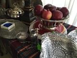 Pewter plates, apple fruit, silver plate serving pieces