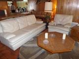 vintage white leathe sofa and matching side chair with foot stool