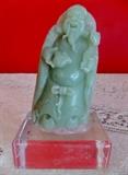 Celadon jade figure with stand