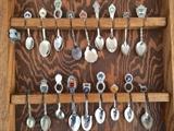 Souvenir spoon collection with display cabinet