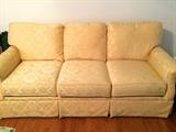 Yellow damask sofa, plump and spotless