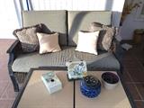 Settee and coffee table of patio set