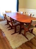 teak oval dining table and six chairs (table has two leaves)