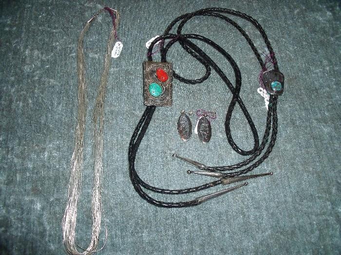  Left - Navajo liquid silver necklace.  Middle - Navajo turquoise and coral, sterling silver bolo tie with Hopi sterling silver earrings.  Right - Navajo sterling silver and turquoise bolo tie.  