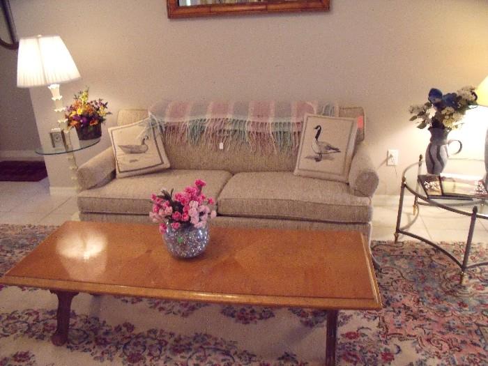 Sofa bed, coffee table and Kirman rug