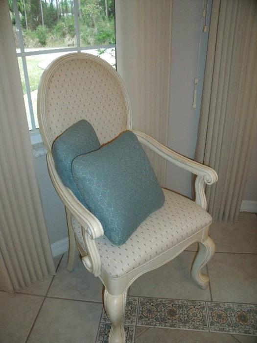 Dining table captains chair with decorative pillows