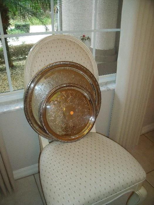 Silver trays on dining chair