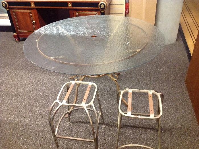 Glass top, rod iron base outdoor table with umbrella hole -$100. Pair of iron stools with no seats $100 pair. 