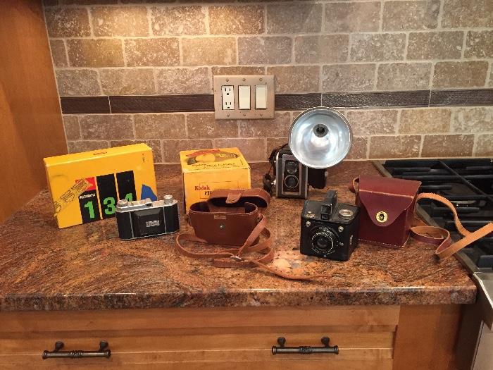 cameras and leather cases with original boxes
