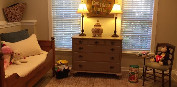 Dresser, vintage chair with velvet seat, vase, and decorative items