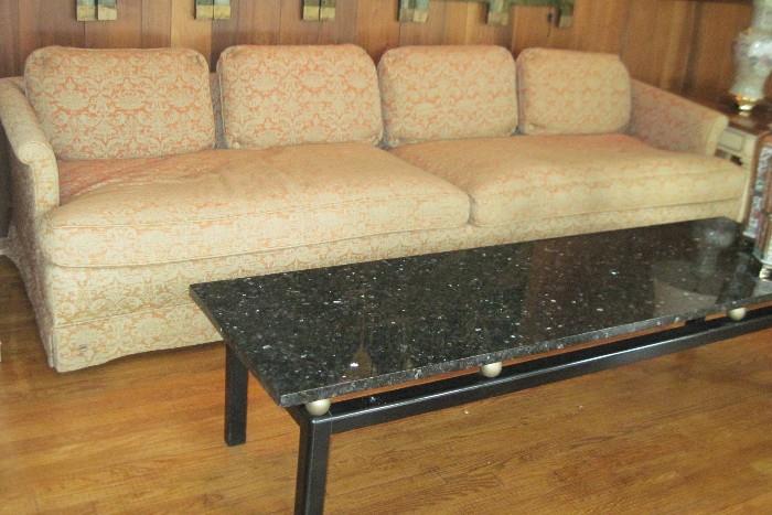 down filled sofa and marble top table