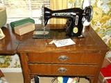 Universal sewing machine in cabinet