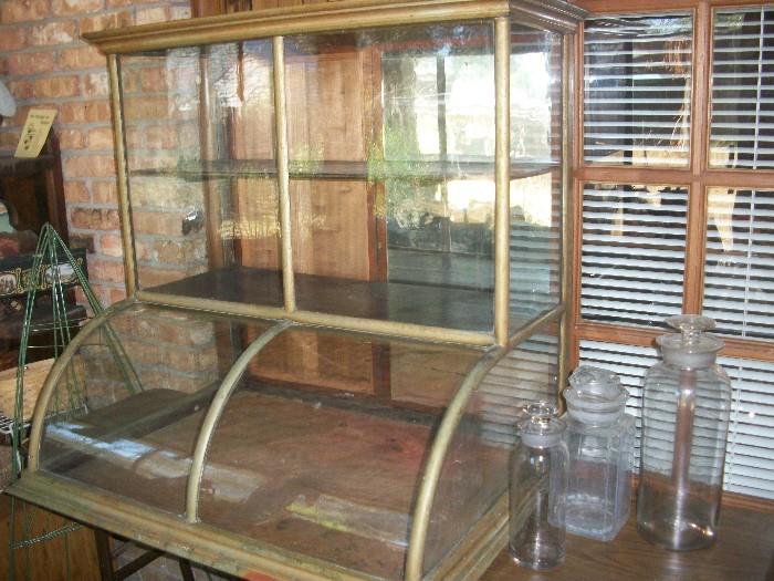 curved glass display case from old New Orleans general store