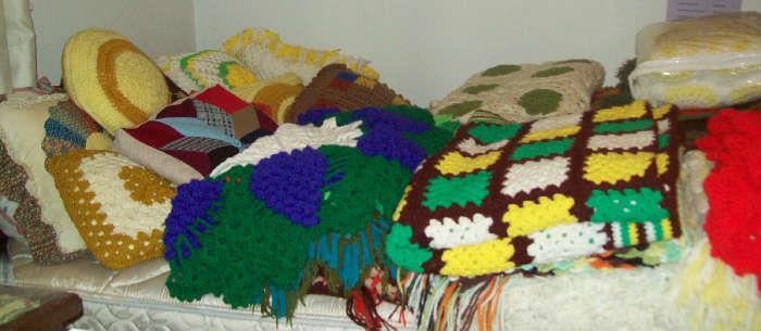 Hand crocheted bed spreads and pillows.