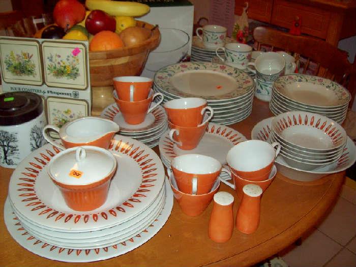 Two sets of dishes, vintage and contemporary.