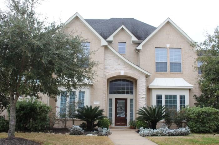 Two-story Grand Lakes home in Katy, Texas featuring 5 bedrooms, 3 ½ bath, formal dining room, study, and beautifully landscaped yard with pool