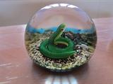 Vintage Baccarat crystal paperweight with coiled green snake
