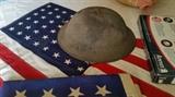 World War I helmet, several 48 star flags