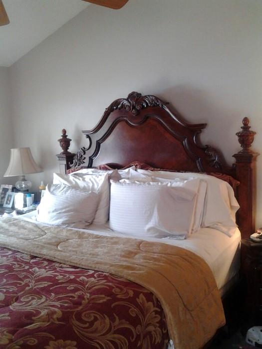 King bed has footboard and side rails.  Also has a matching dresser with mirror, Armoire, and two nightstands.