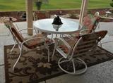 Patio table (glass top) with four chairs.