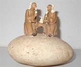 mud men on rock