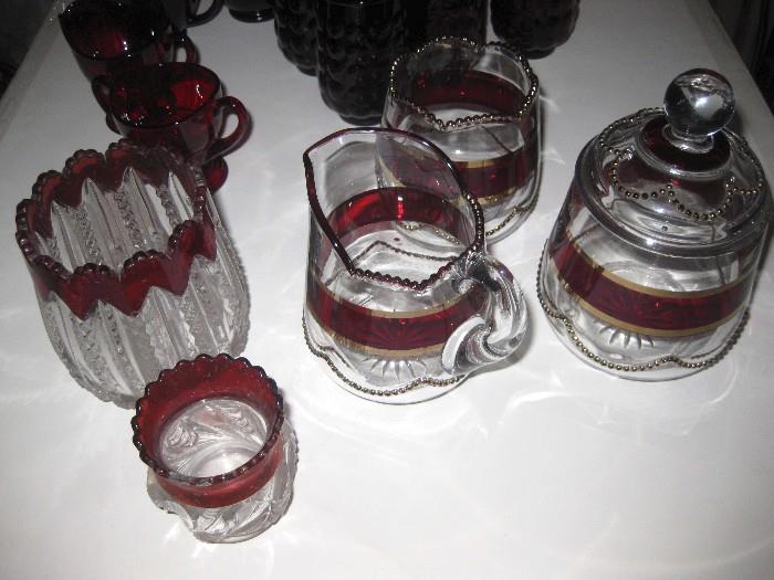 Various rimmed cranberry items
