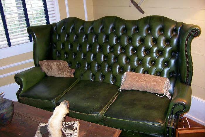 Close-up of the green leather sofa