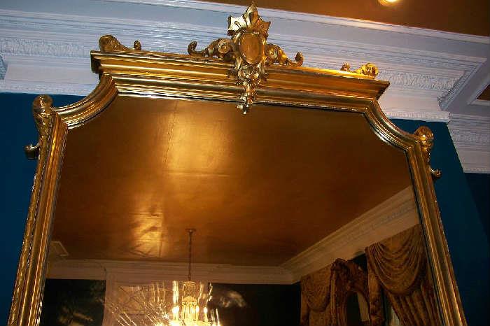 the top to a gorgeous antique mirror found in the dining room