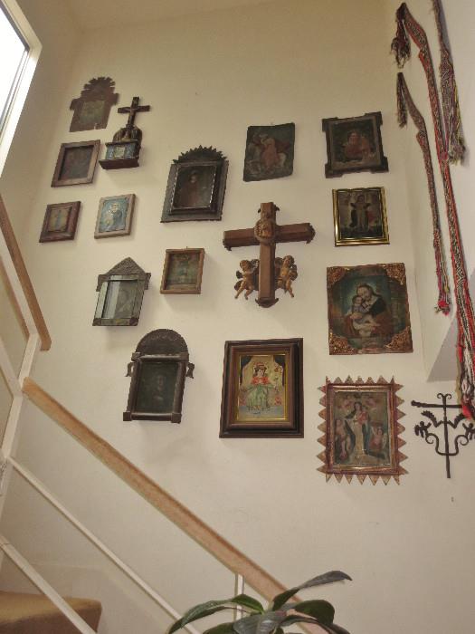 A view of the Retablo collection in the stairwell of the home prior to moving to The Estate Sale Gallery