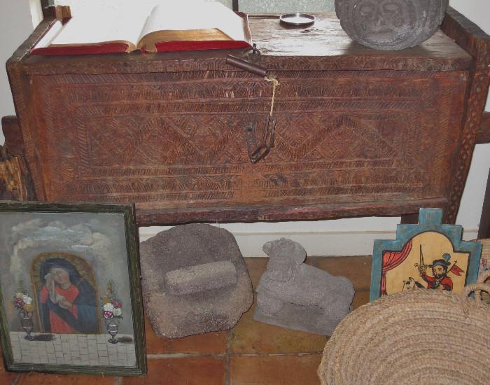 Vignette of an Afghan chest, retablos and stone artifacts