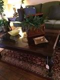    Like-new coffee table with various decorative items