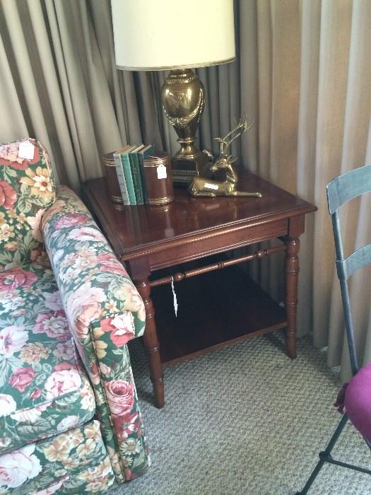 Another sofa, end table, lamp, and leather book ends