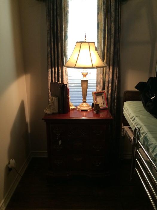            Nightstand, lamp, and hospital bed