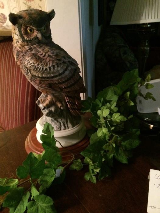                 Large owl on wooden stand
