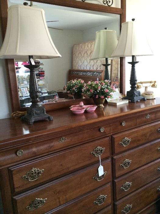 Tall dresser has matching bed, nightstands, & chest.