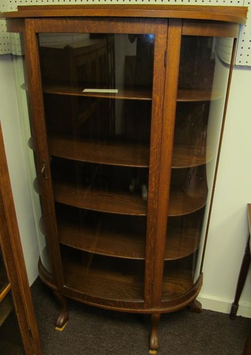 #29 Oak 4 wood shelf bow front china cabinet 58 1/2" High X 60" to top of back splash X 36 1/2" Wide X 14 1/2" Deep.