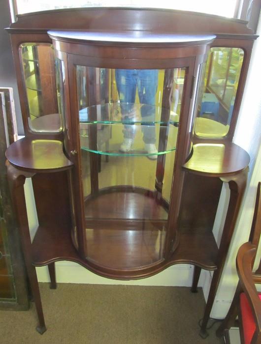 Mahogany Fancy Single Door Curio Cabinet. Full length mirror inside the cabinet and a mirror above each side shelf. 52" High X 54 1/2" to top of Back splash X 35" Wide X 13 1/2" Deep