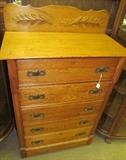 Oak 5 drawer chest with ornate splash board 47" High X 54 1/2" High to top of splash board X 34" Wide X 18" Deep