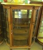 #5 Oak bow front china cabinet claw feet 4 wood shelves top one mirrored 62 1/2" High X 46" Wide X 19" Deep