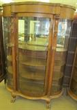 #4 Oak bow front china cabinet with Griffins 1 glass shelf 3 wood shelves 4 claw feet 68" High X 49" Wide X 20" Deep