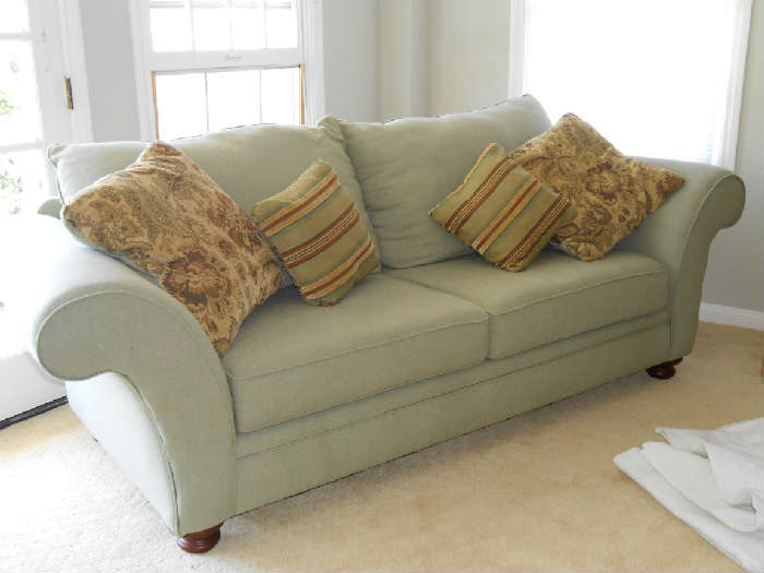 Pale green sofa $250 in bedroom