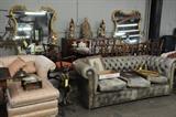 Tufted leather sofa, Gilt carved mirrors