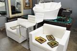Modern white club chairs, love seat, and bar stools