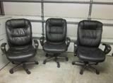 Three executive chairs. Rolling, adjustable height and tilt back.