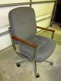 Cool, mid century modern style desk chair, stainless steel & wood arm rests. Rolling, tilts, made by Globe.