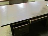 Solid wood base and drawers Deco style desk. Laminate top, nice hardware.