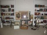Hard cover books, art, chandeliers (one brass, one iron with shades, one cermaic blue & white, accessories, photo frames in baskets