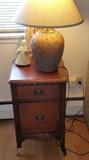 Old nightstand....needs TLC...great pottery lamp...signed