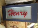 "Henry" in metal on vintage wood