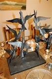 Fantastic metal birds sculpture